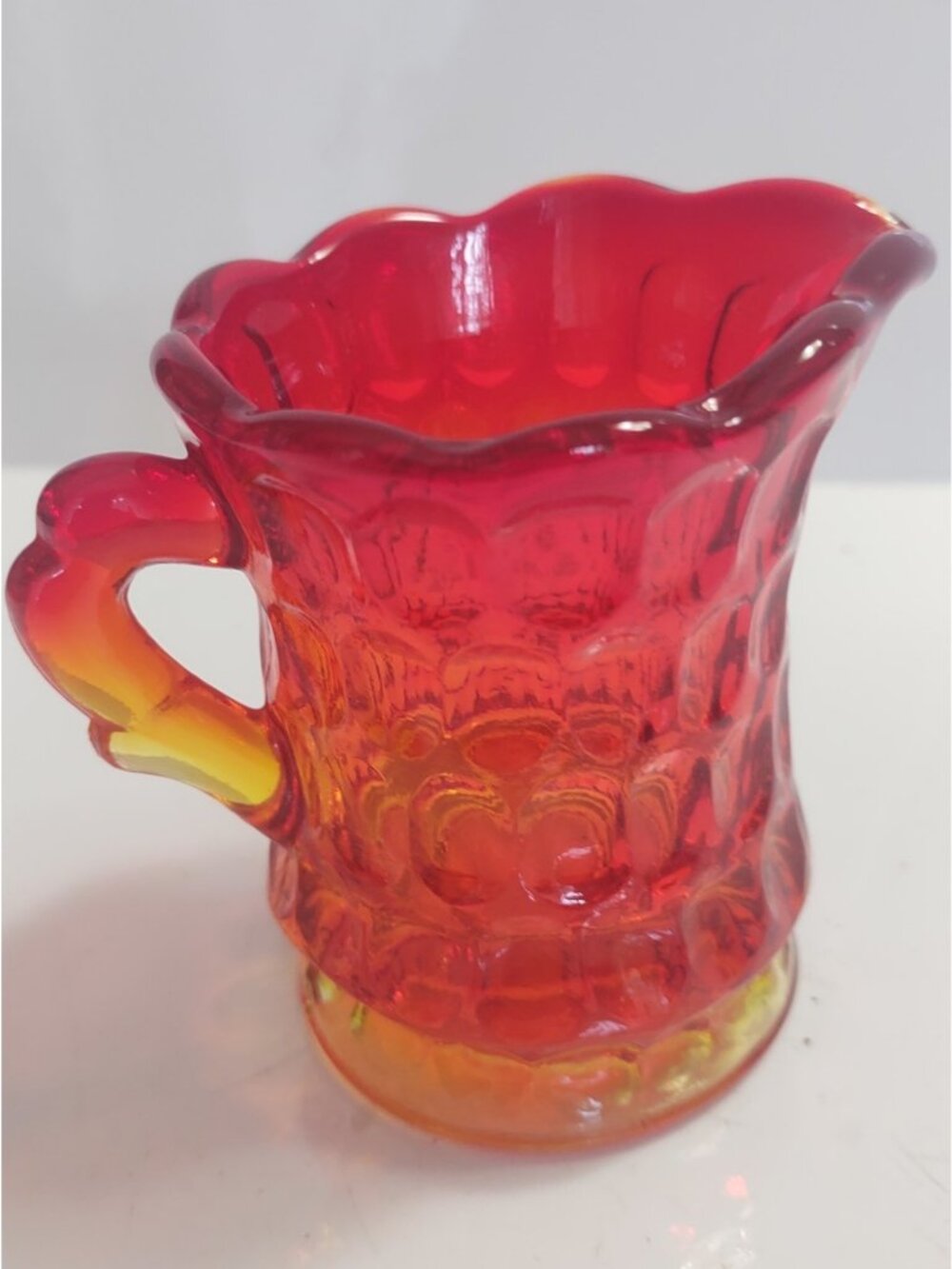 Vintage Amberina small creamer. Bright yellow orange deep red scalloped 3 1/4"